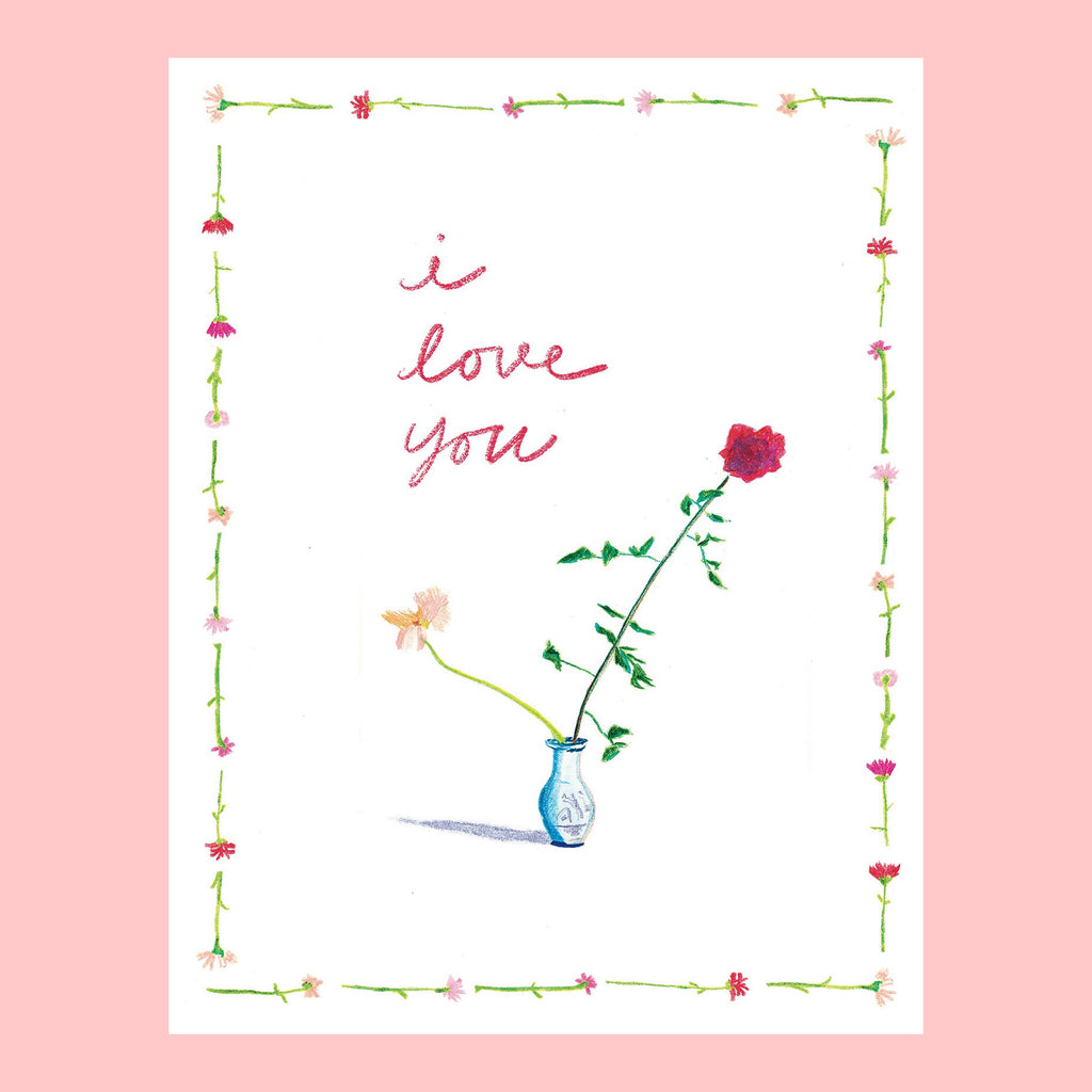 I love you greeting card with a single rose in a flower vase. The card says I Love You as a greeting